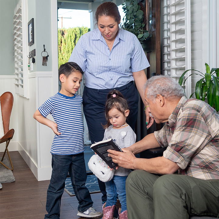 A woman and her children arriving at their grandpa's house