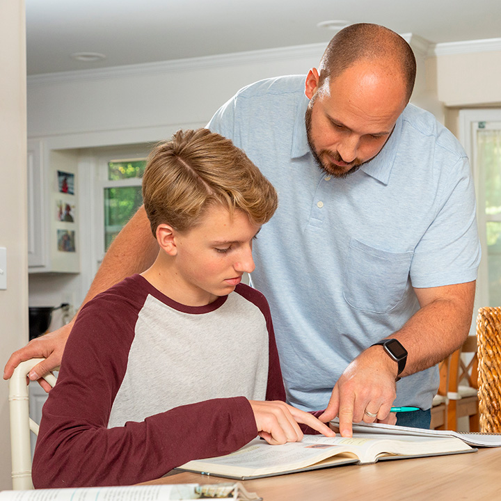 A father helping his son with homework