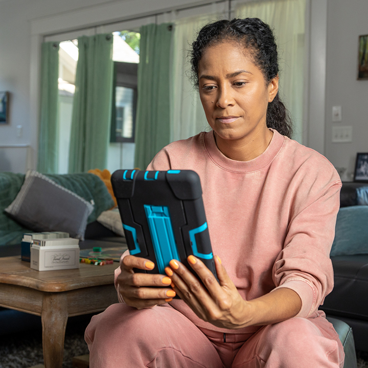 Woman applying for life insurance on a tablet