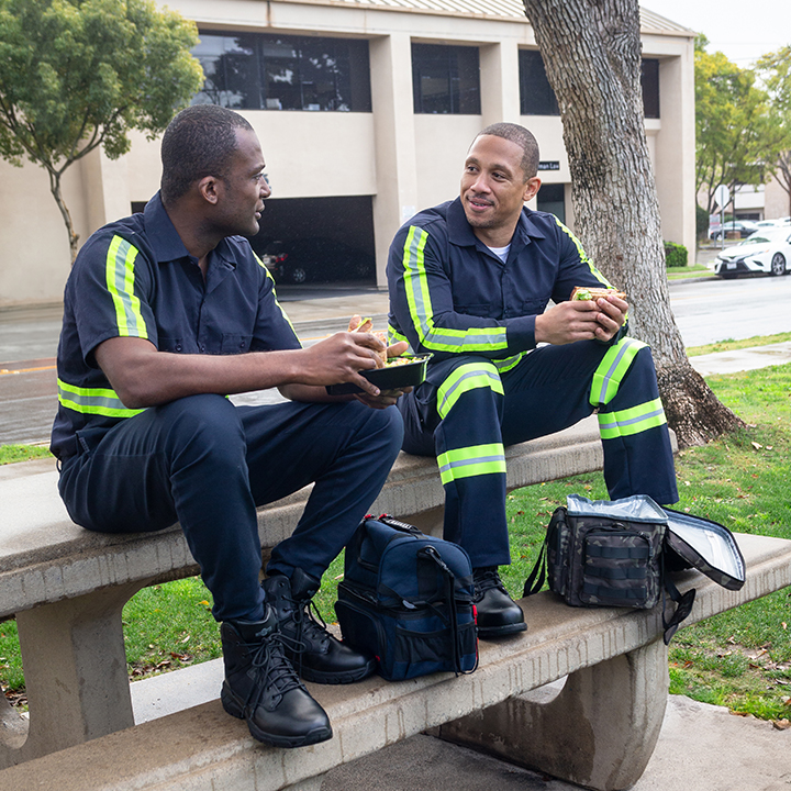 Hard-working EMTs discuss life insurance vs ad&d on their lunch break outdoors