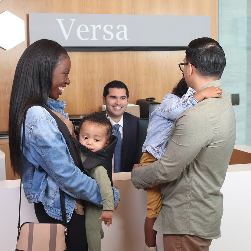 Family at their credit union, discussing the contribution TruStage is making to the African-American Credit Union Coalition’s Future Fund