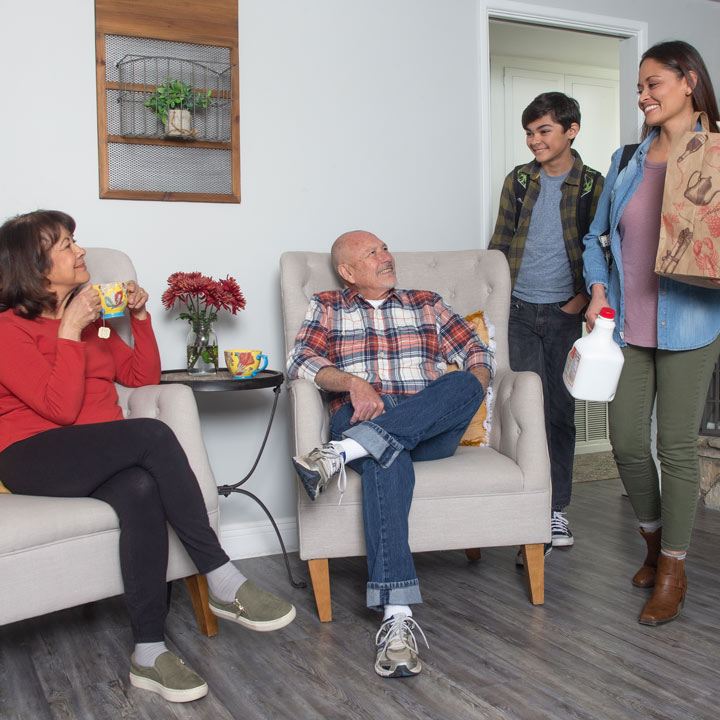 Family discussing if homeowners insurance covers mold.